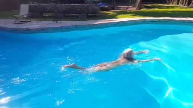 Nata Lee by the swimming pool